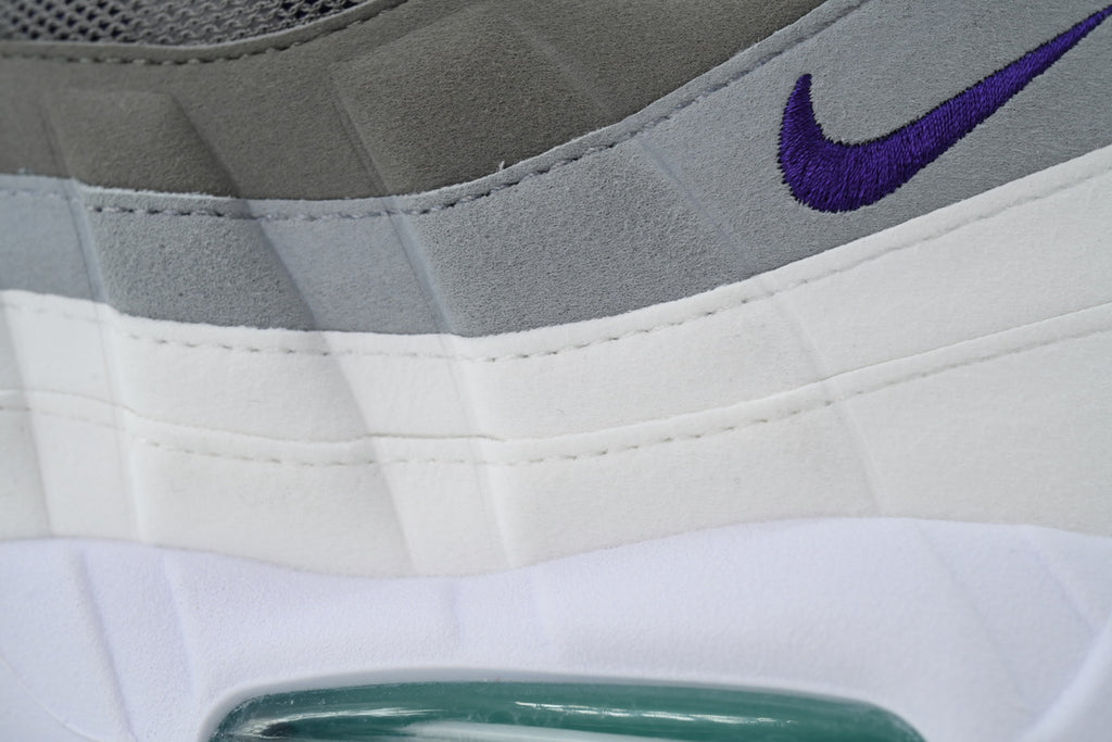 Nike Air Max 95 in a white, grey, and purple colorway.