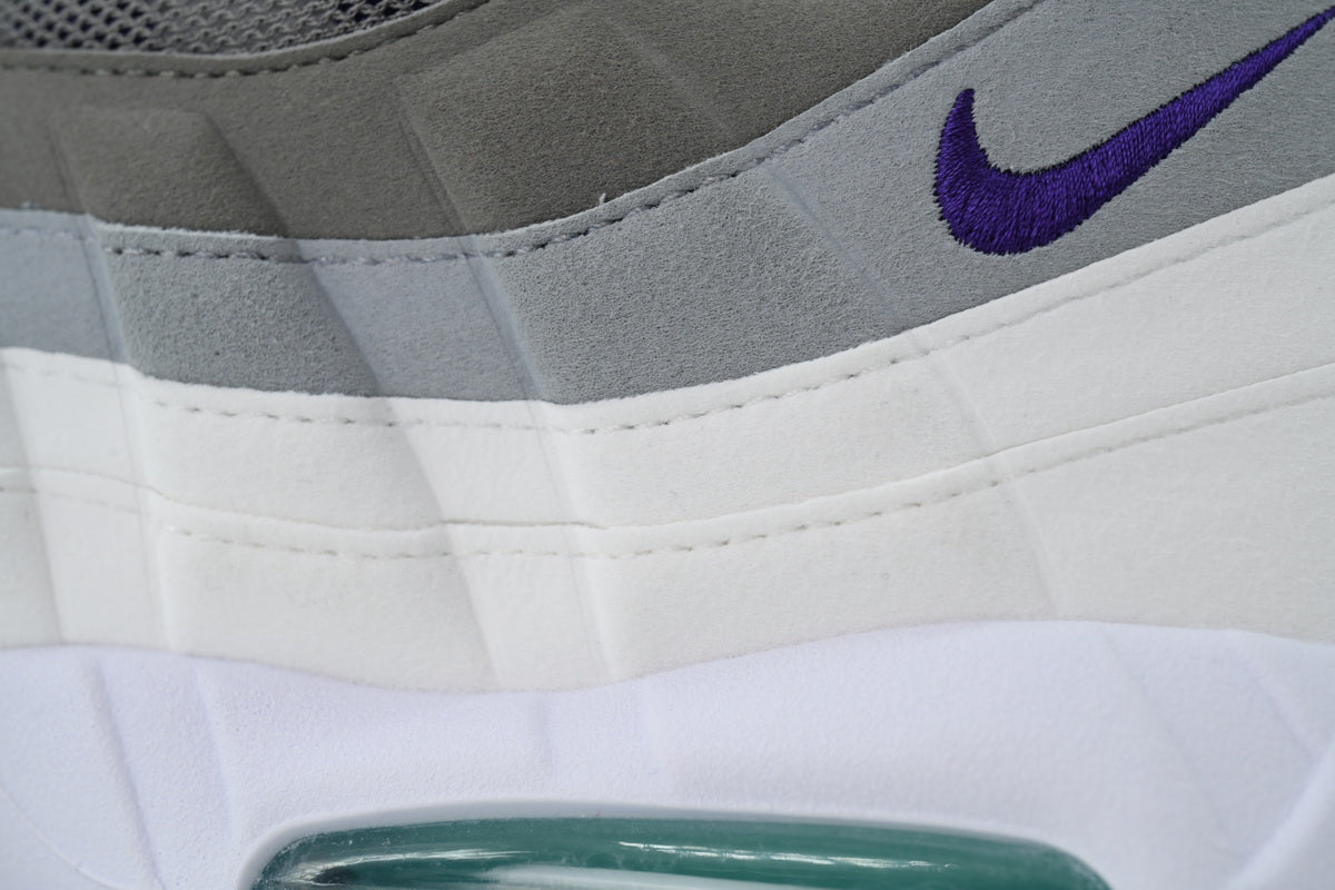 Nike Air Max 95 in a white, grey, and purple colorway.
