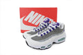 Nike Air Max 95 in a white, grey, and purple colorway.