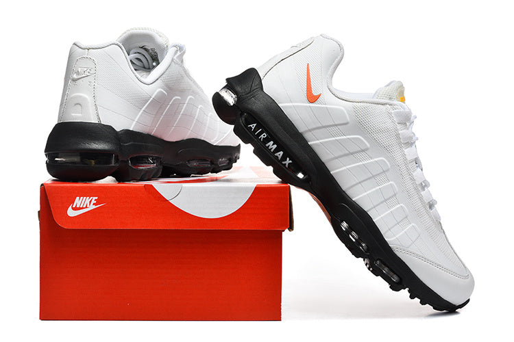 Nike Air Max 95 in a white/orange/black colorway.