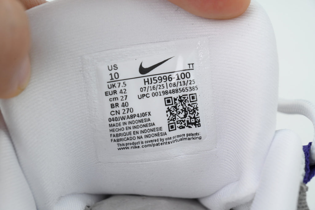 Nike Air Max 95 in a white, grey, and purple colorway.